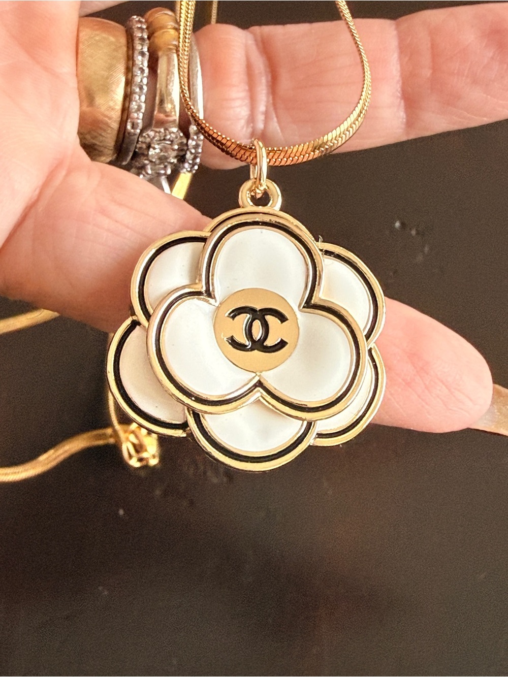 CC EUC Camellia enamel 
Flower charm on 22” Serpentine
304 Gold stainless chain